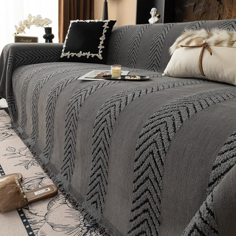 Close-up of soft chenille herringbone weave on a sofa throw, home decor accent