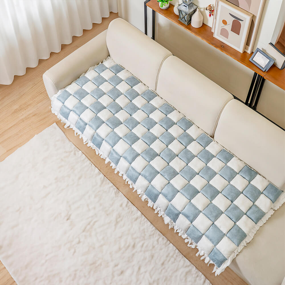 Close-up showing the non-slip backing of the pet mat, securing it on the couch