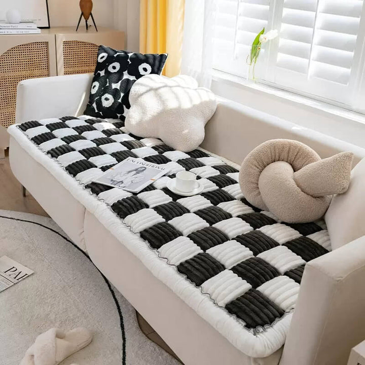 Washable pet mat on a brown sofa, protecting furniture from dogs & cats