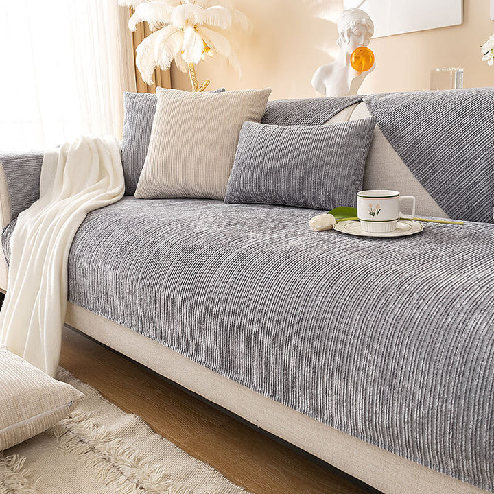 Chenille scratch-resistant sofa cover in a living room, protecting a couch from pets