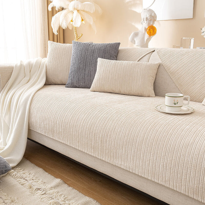 Non-slip chenille sofa protector draped over a three-seat couch for pet owners