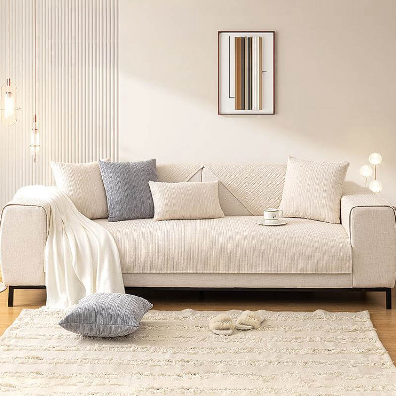Washable chenille couch cover in a neutral tone, designed for furniture protection