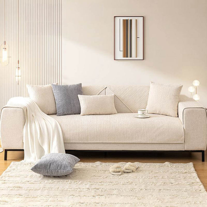 Washable chenille couch cover in a neutral tone, designed for furniture protection