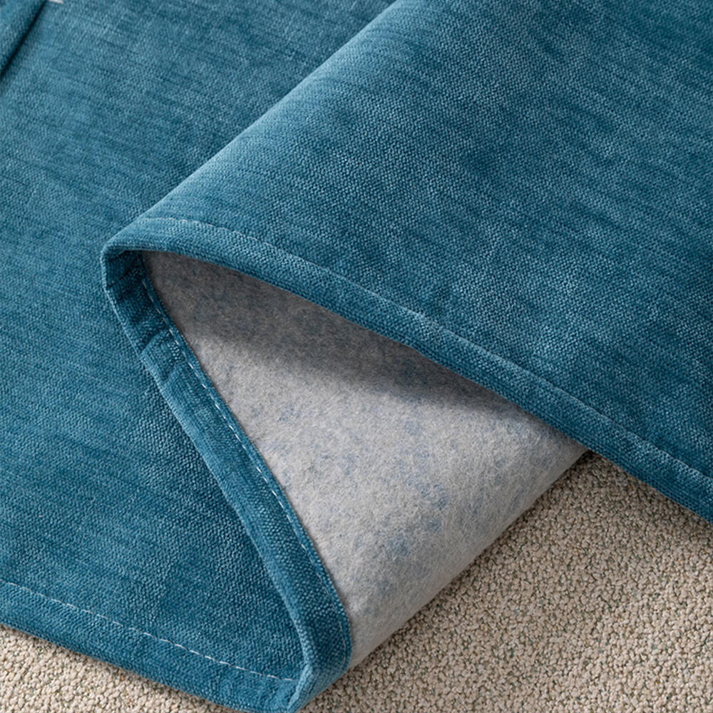 Living room scene with a beige chenille sofa armrest cover, demonstrating home decor and storage