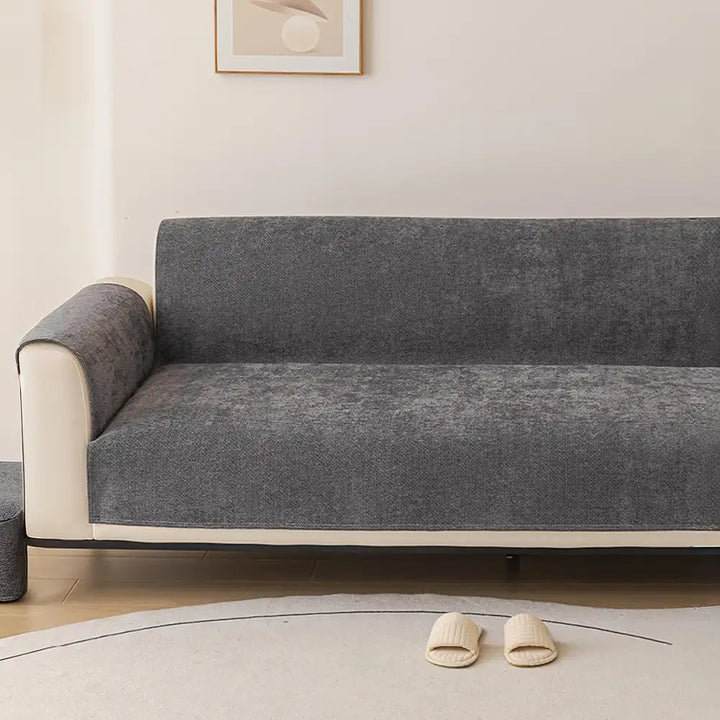 Scratch-resistant chenille sofa cover safeguarding a fabric couch, combining function with home decor.