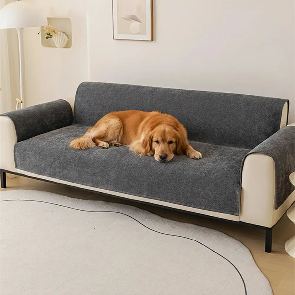 Water-repellent chenille sofa protector draped over a two-seater couch, easy-care home decor.
