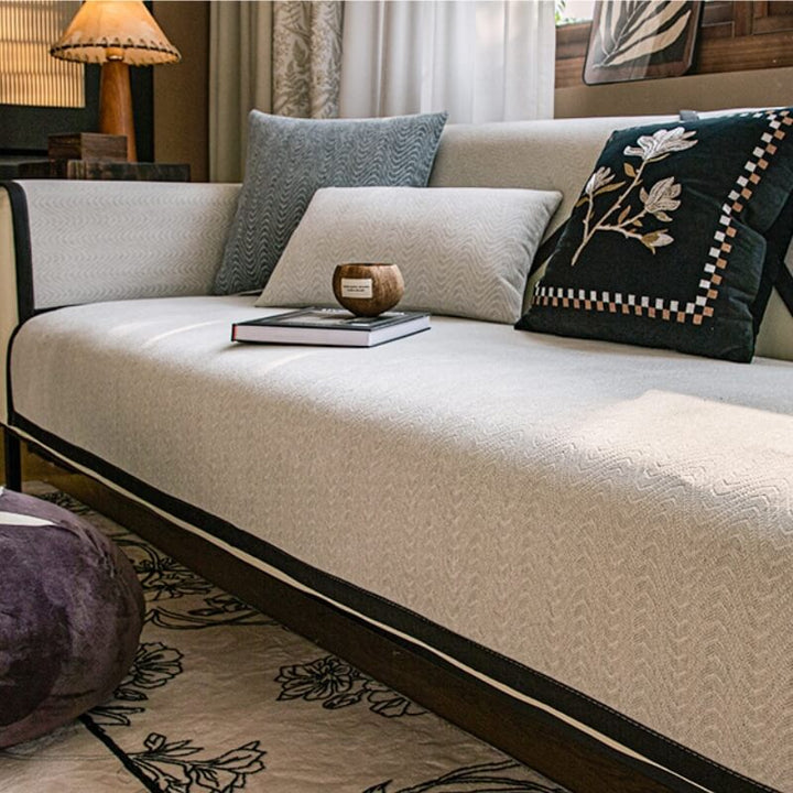 Close up of textured chenille sofa cover showing anti-scratch fabric for furniture protection