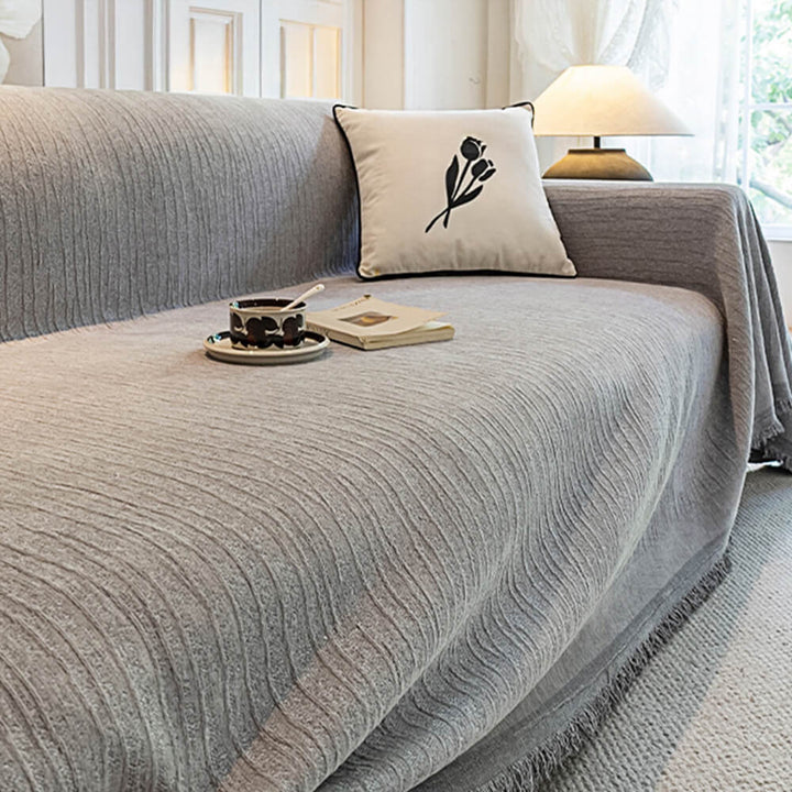 Close-up of chenille fabric, highlighting its texture on a pet-friendly anti-scratch couch cover.