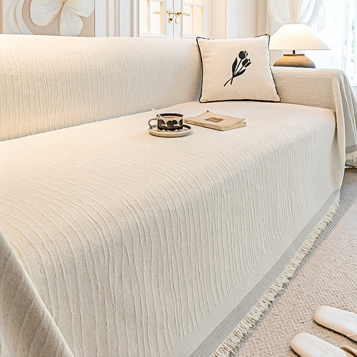 Corner of a sofa showing the fit of the chenille pet-friendly anti-scratch throw couch cover.