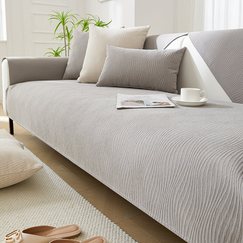 Full view of sofa covered with non-slip chenille wood grain cover, enhancing home decor