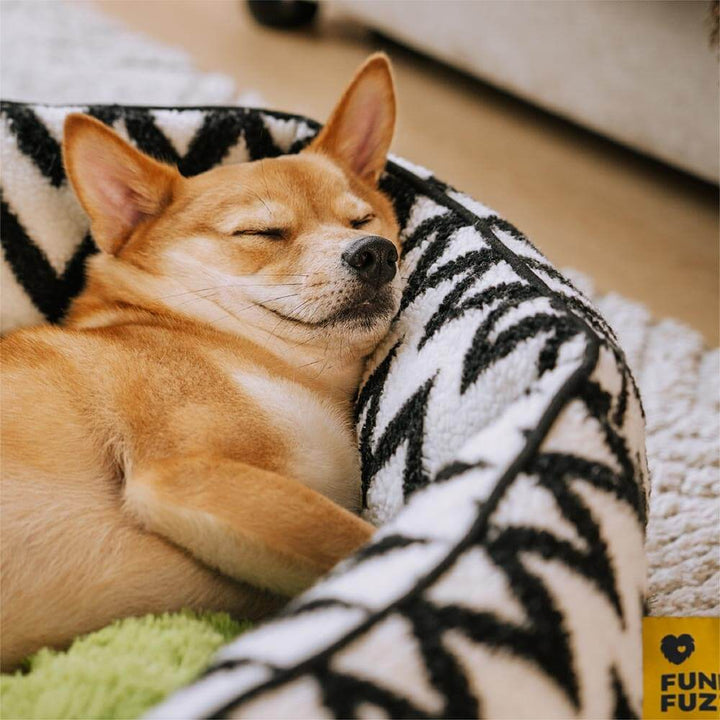 Medium-sized chevron dog bed in grey and white, soft and durable.