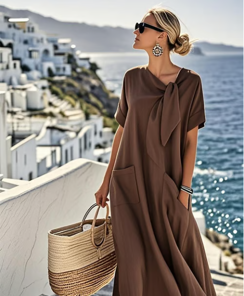Women's short sleeve A-line midi dress, a chic & comfortable everyday summer dress. Features versatile style & pockets.