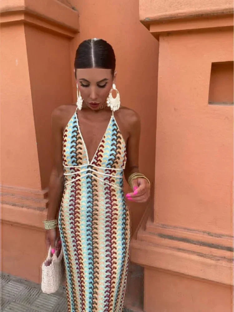 Flowy boho maxi dress with chic print, halter neckline, comfortable for a wedding guest or vacation.