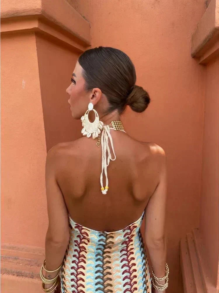Women's elegant halter neck boho maxi dress with unique print, open back, perfect party or wedding guest wear.