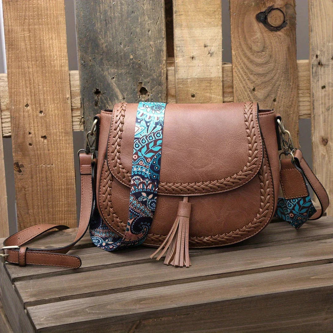 Elegant black women's crossbody saddle bag, perfect everyday fashion accessory.