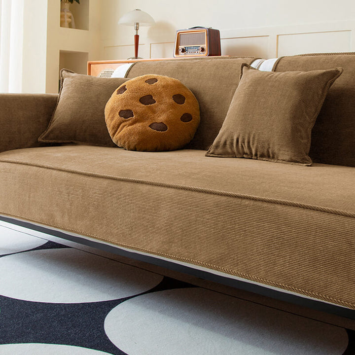 Stylish corduroy sofa protector in a modern blue, offering anti-slip and pet-safe furniture cover