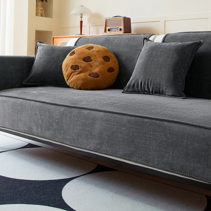 Luxurious corduroy sectional cover with non-slip backing, a pet-friendly sofa protector in grey