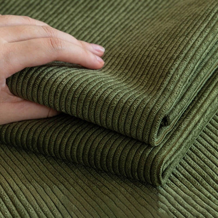 Detail of a soft corduroy fabric sofa protector, showing anti-slip texture for pet and furniture care