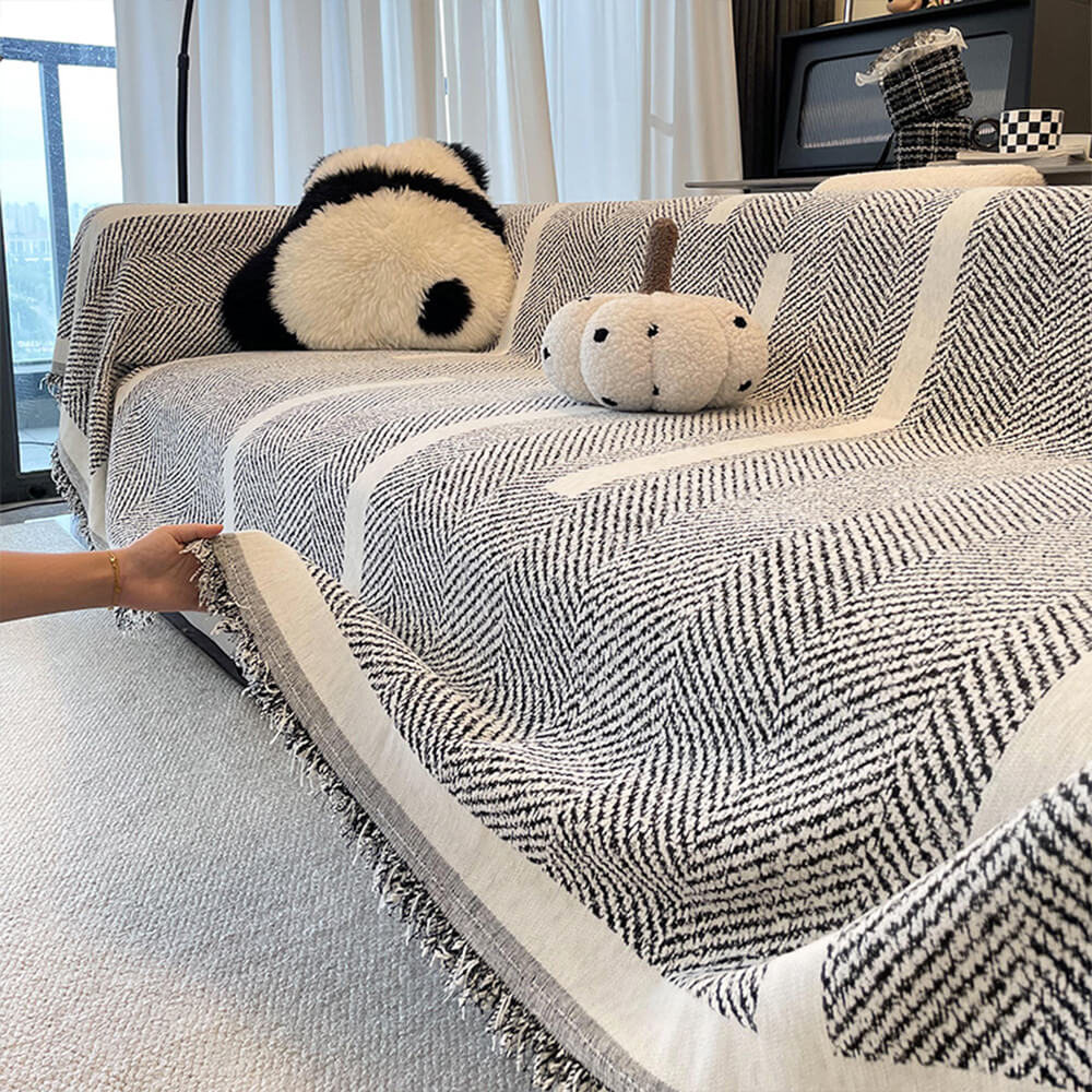 Soft-touch herringbone chenille throw, a practical and chic sofa protector for any living room