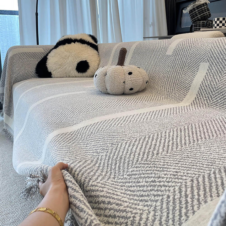 Machine washable chenille couch cover in a neutral tone, protecting a sofa