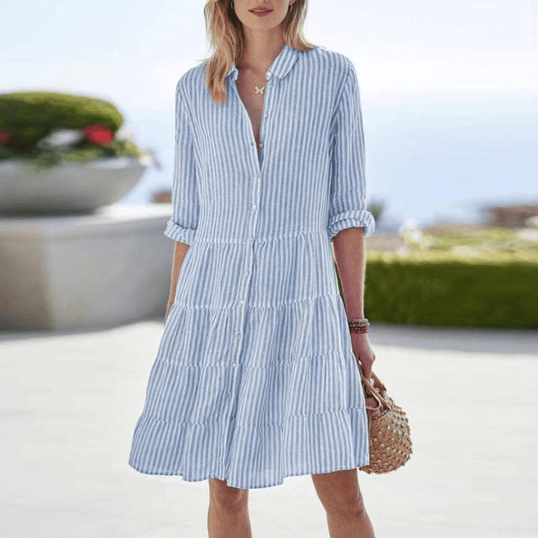 Chic striped mini summer dress for women, perfect for beach days & casual wear. Effortless style.