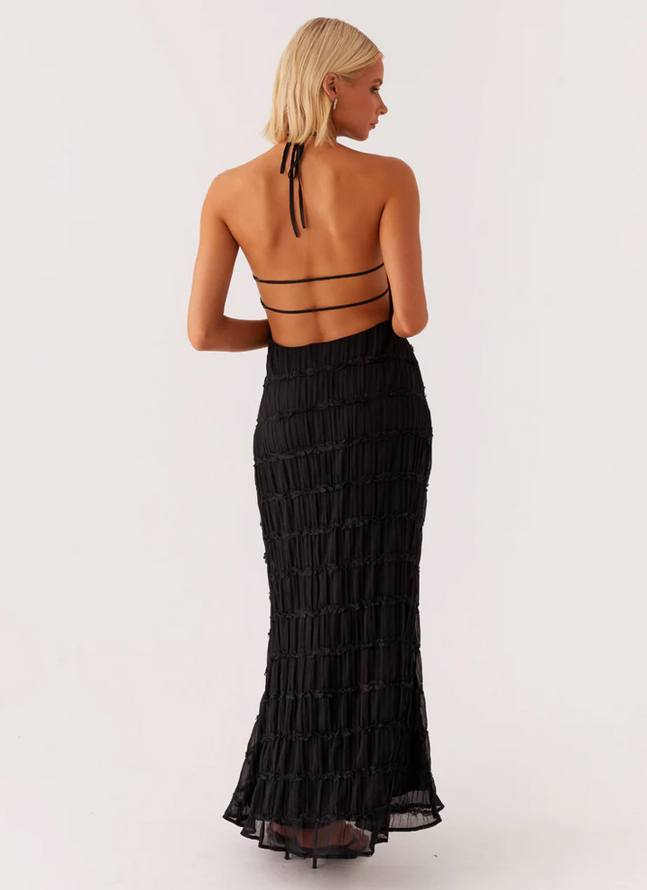 Formal pink textured halter maxi dress, a stylish wedding guest or evening gown.