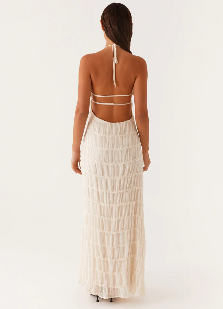 Sophisticated black textured halter maxi dress, ideal for any special occasion.