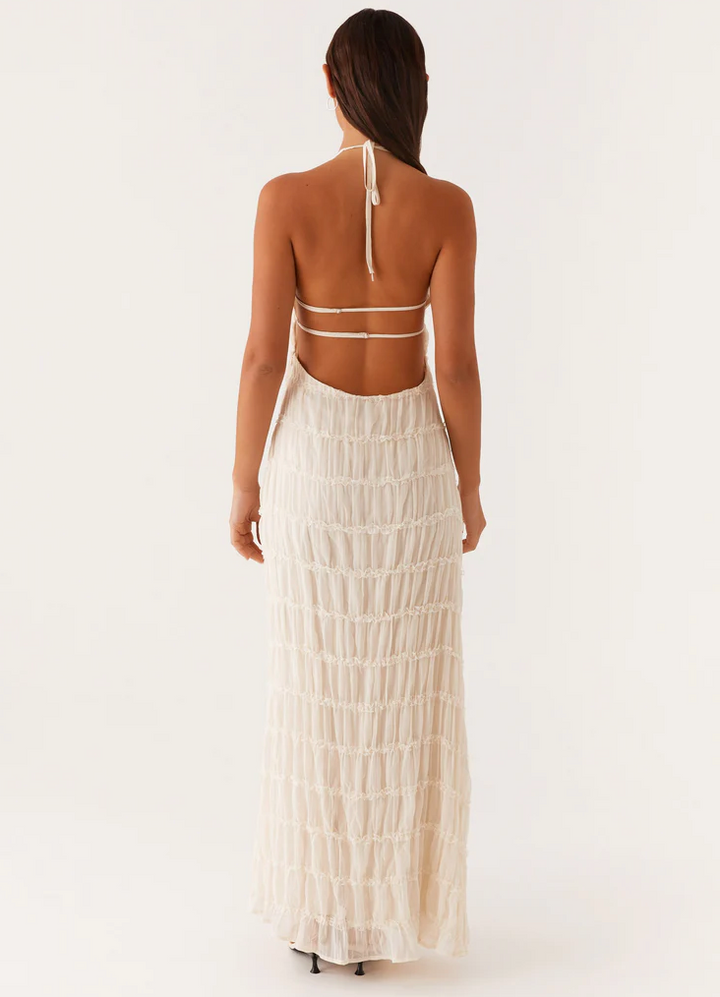 Sophisticated black textured halter maxi dress, ideal for any special occasion.