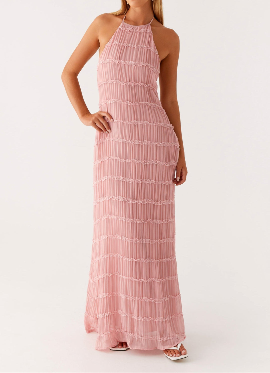 Women's elegant pink textured halter maxi dress, perfect for wedding guests.