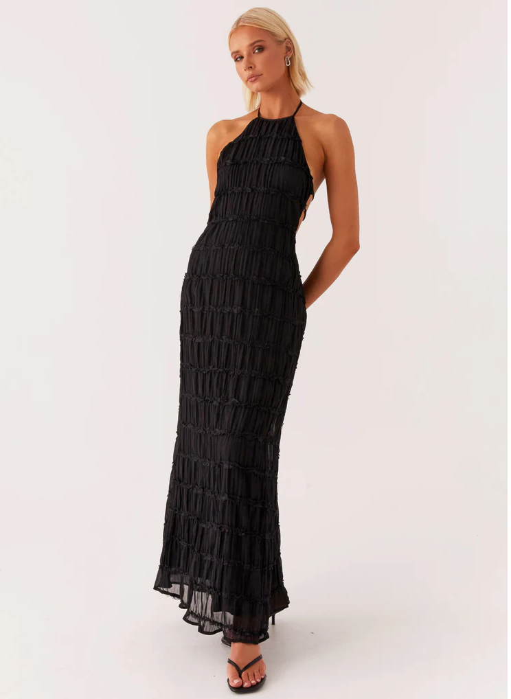 Black textured halter maxi gown, a sophisticated choice for formal evening events.