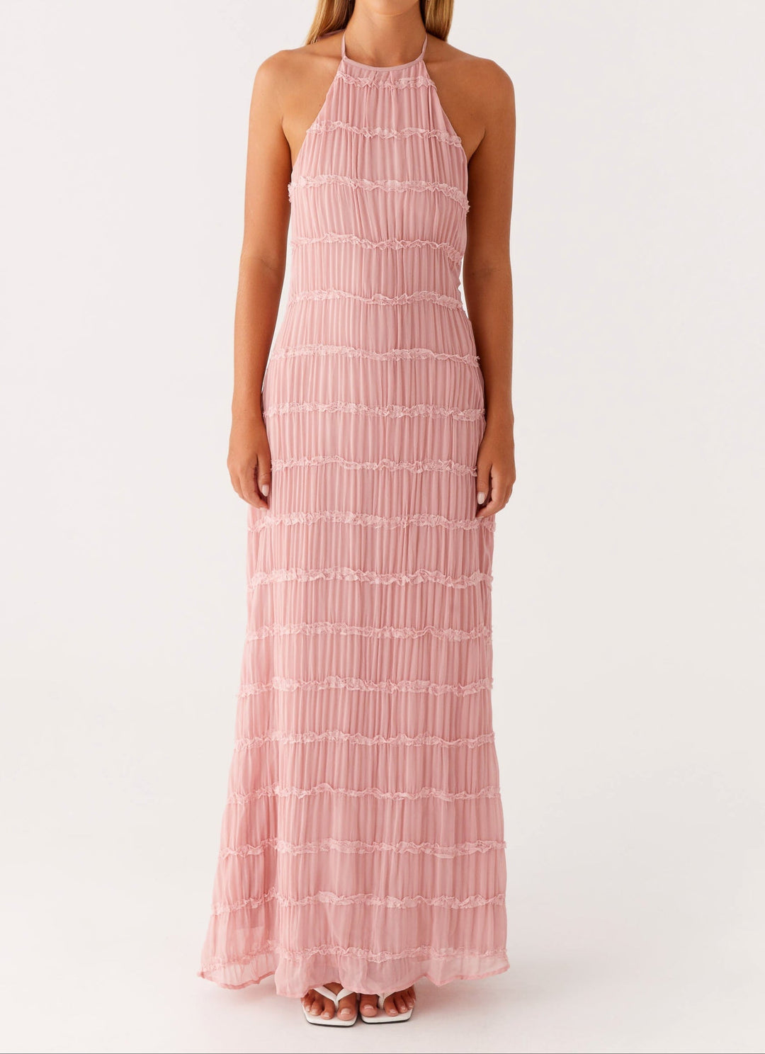 Women's elegant textured maxi dress with a halter neck, perfect for wedding guests.
