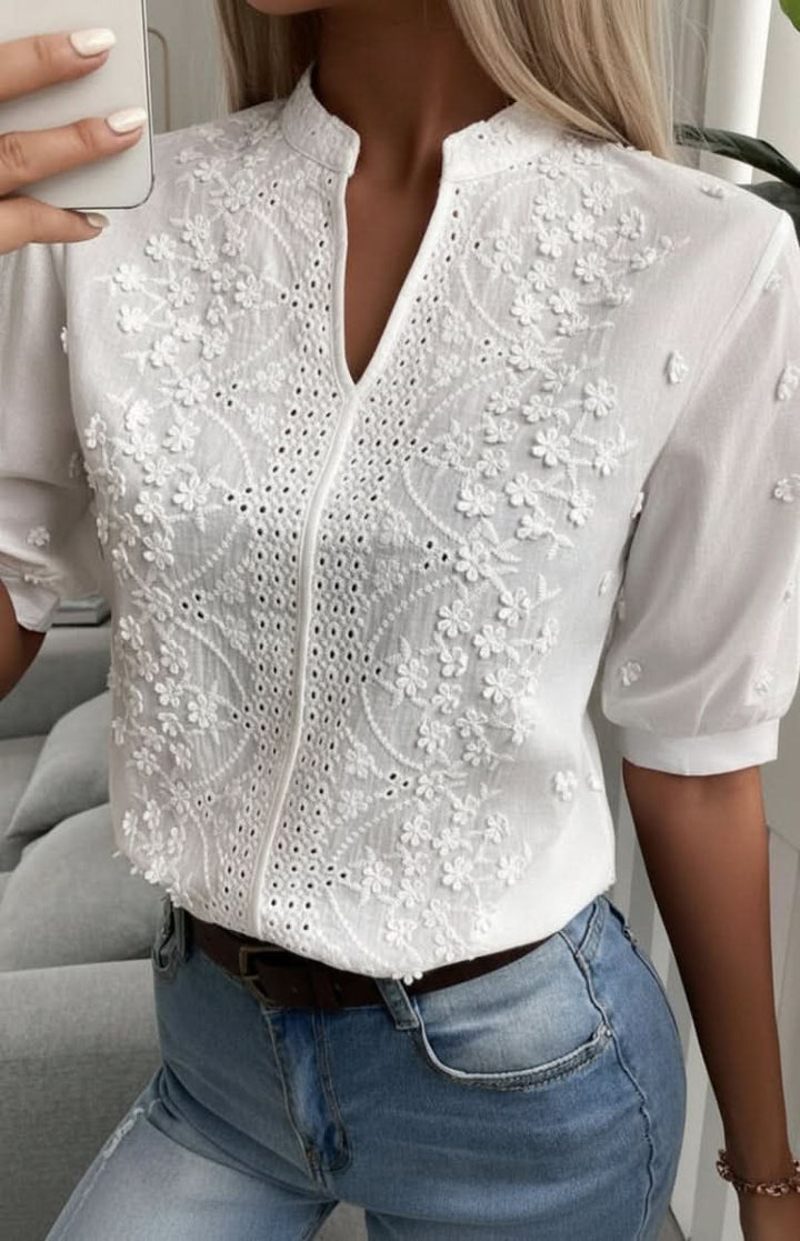 Flattering women's chic V-neck top, an elegant blouse designed for versatile wear and comfortable office style.