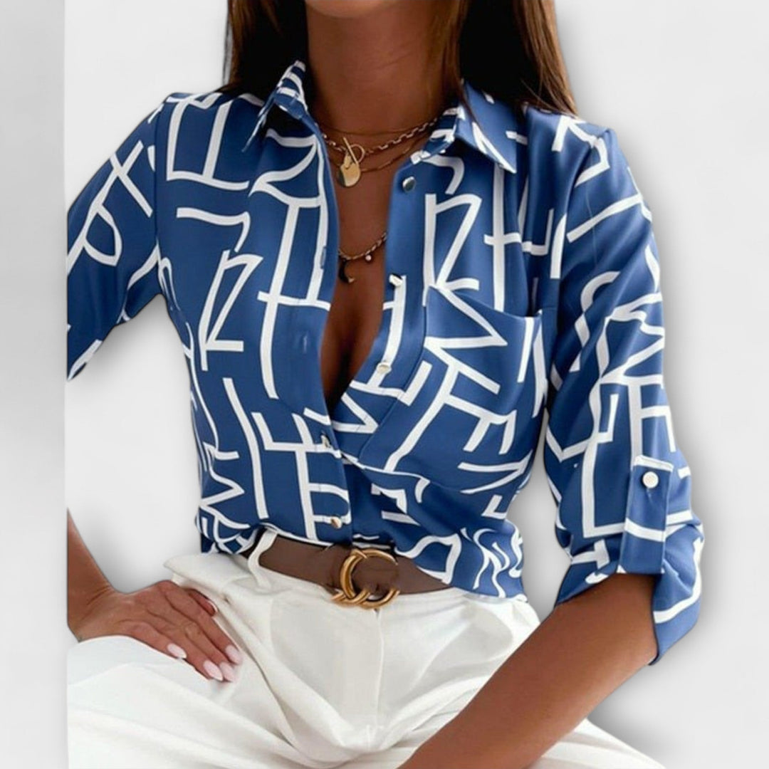 Stylish women's blouse with unique abstract print. Button-front, long sleeve, versatile top.