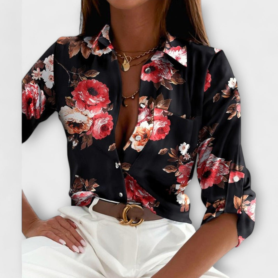 Close-up of the unique abstract print on a women's button-down long sleeve blouse.