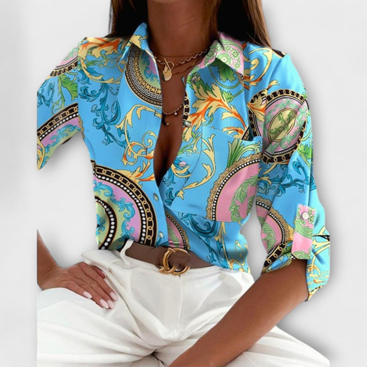 Women's versatile abstract print button-down blouse styled casually. Relaxed fit top.