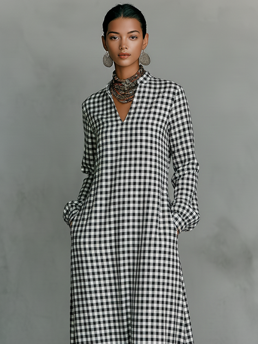 Casual women's A-line gingham maxi dress with long sleeves & V-neck, ideal for everyday modest spring fashion.
