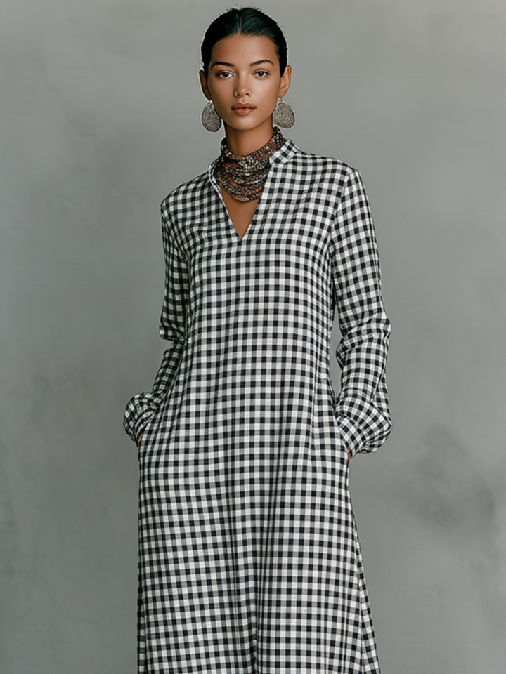 Casual women's A-line gingham maxi dress with long sleeves & V-neck, ideal for everyday modest spring fashion.