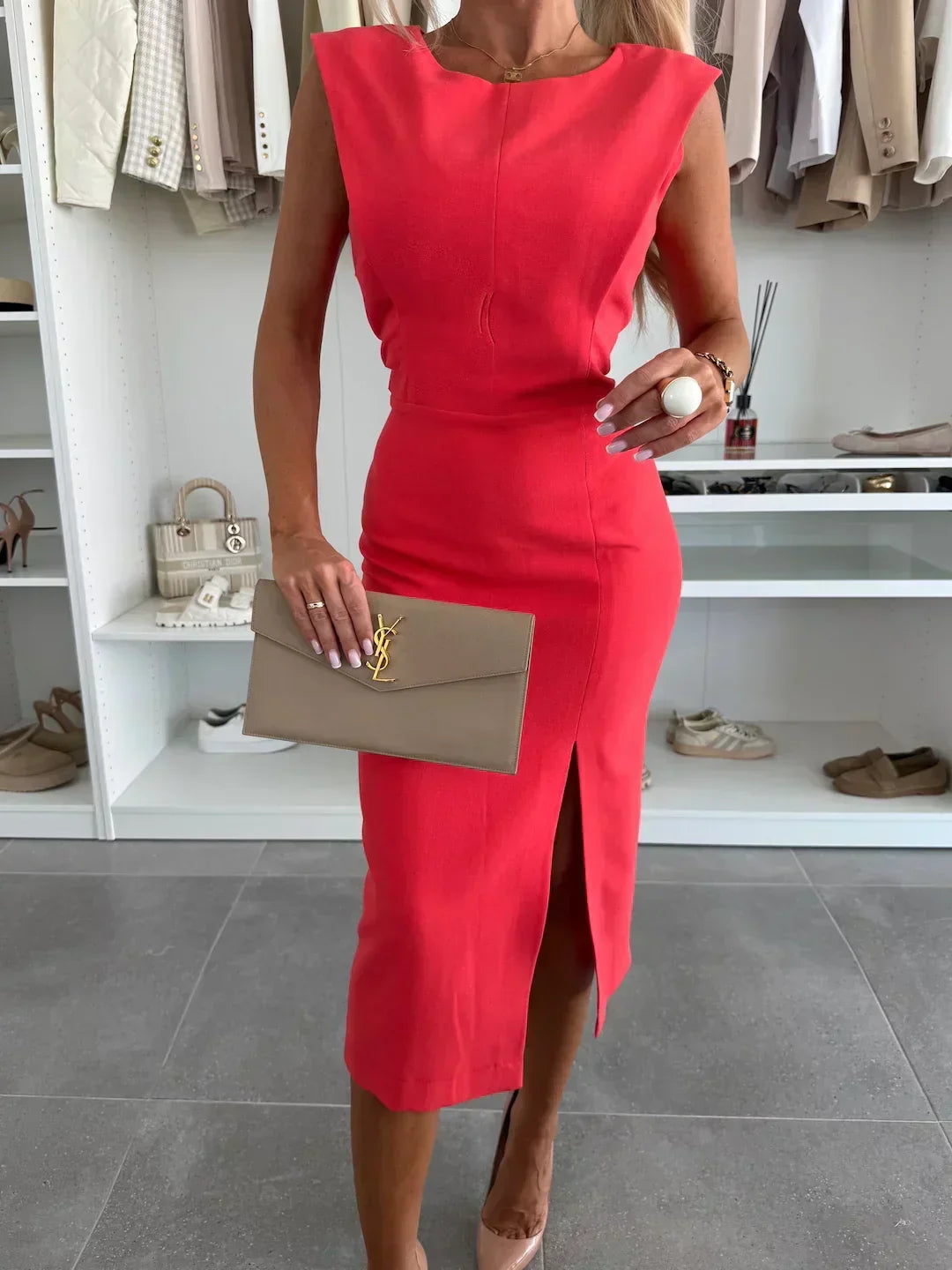 Elegant sleeveless bodycon midi dress for women, featuring a high side slit. Perfect chic outfit for parties & night outs.