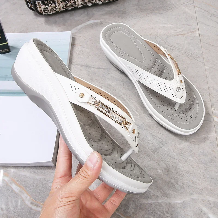 Chic women's cushioned flip flop sandals with decorative strap for comfortable everyday wear. Perfect for summer.