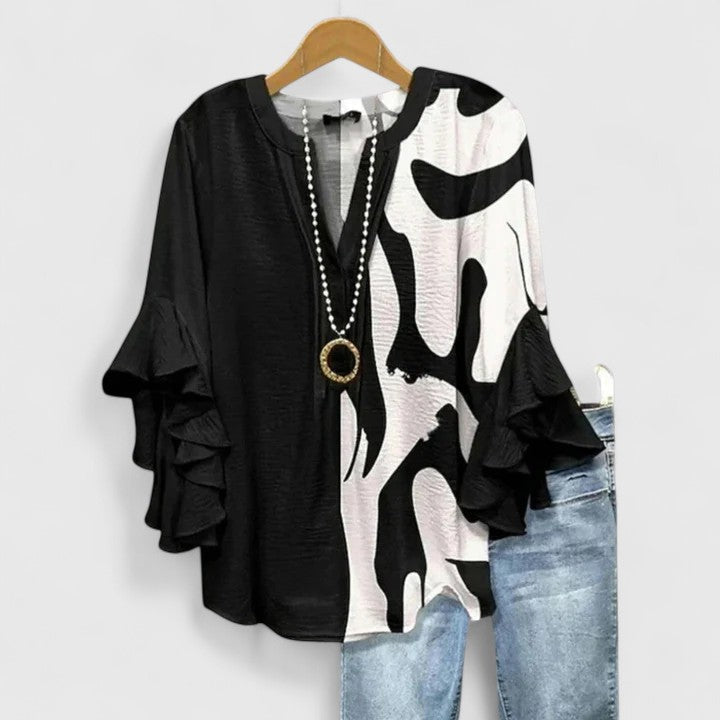 Feminine floral blouse for women, ideal for summer fashion. An elegant & chic top with a vibrant print.