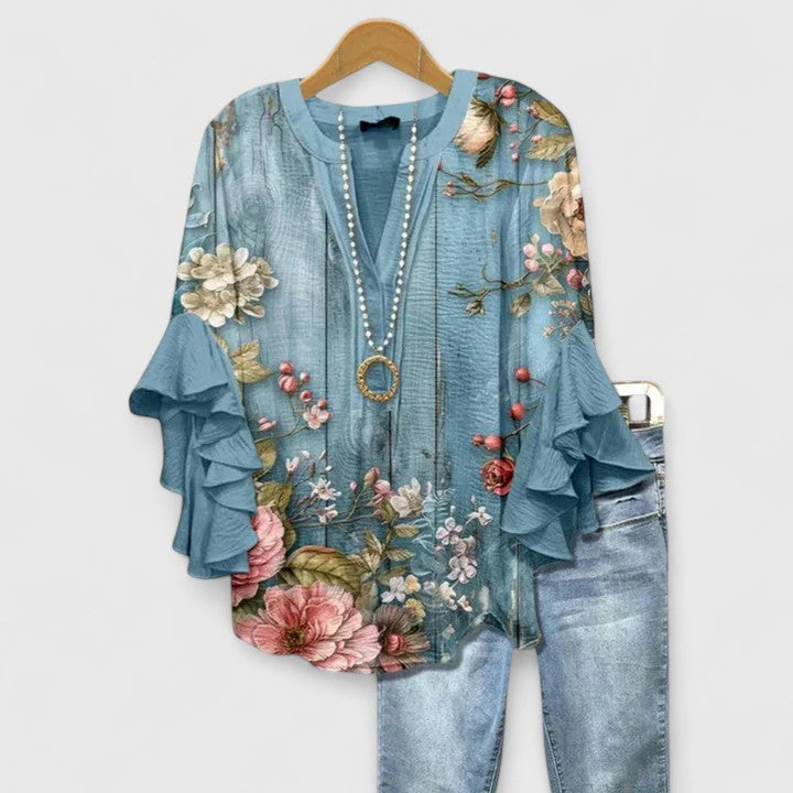 Stylish women's floral top with vibrant print. A chic & versatile blouse perfect for everyday elegance.