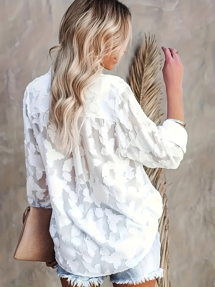 Stylish women's jacquard V-neck blouse. Elegant long sleeve top, perfect workwear or evening attire.