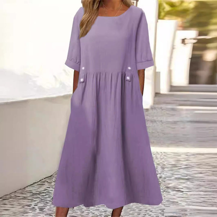Chic women's loose fit midi dress with round neck, perfect for effortless summer style and comfort.