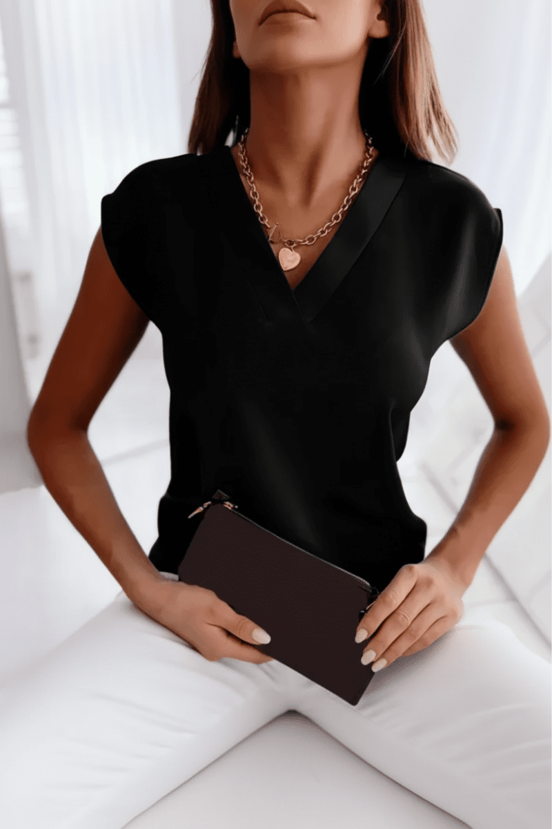 Trendy open back women's top. Sleek sleeveless design, round neck, perfect for a chic summer look or night out.