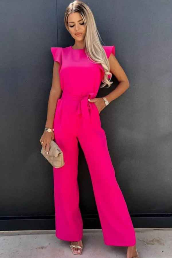 Confident women's high-waist jumpsuit featuring a stylish open-back design. Modern fashion.