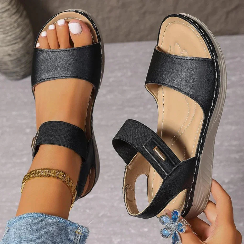 Chic women's open-toe summer sandals, perfect for casual everyday wear. Comfortable slip-on warm weather footwear.