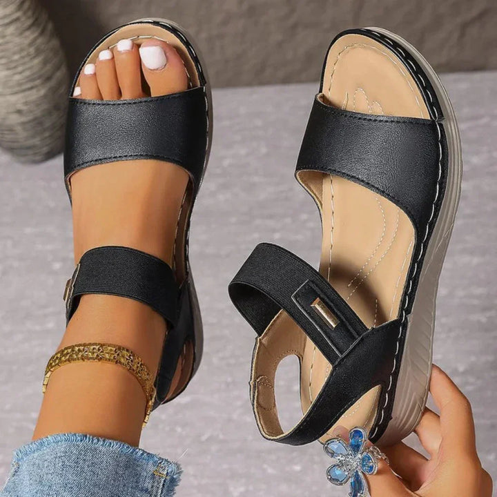 Chic women's open-toe summer sandals, perfect for casual everyday wear. Comfortable slip-on warm weather footwear.