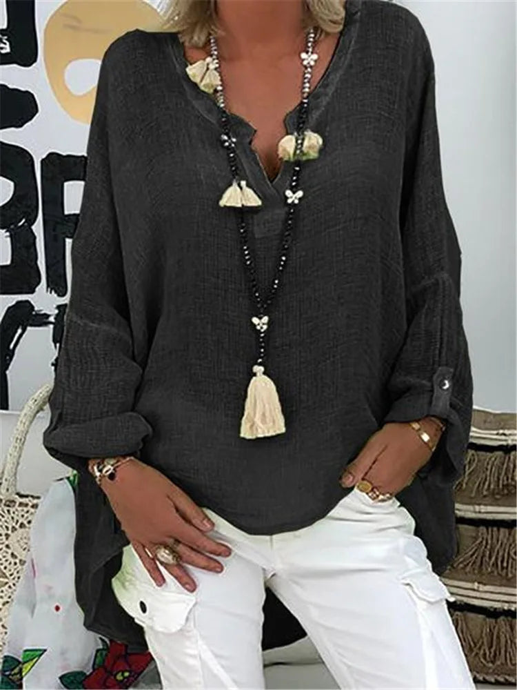 Relaxed fit oversized women's blouse in a light fabric, offering comfort & modern chic style.