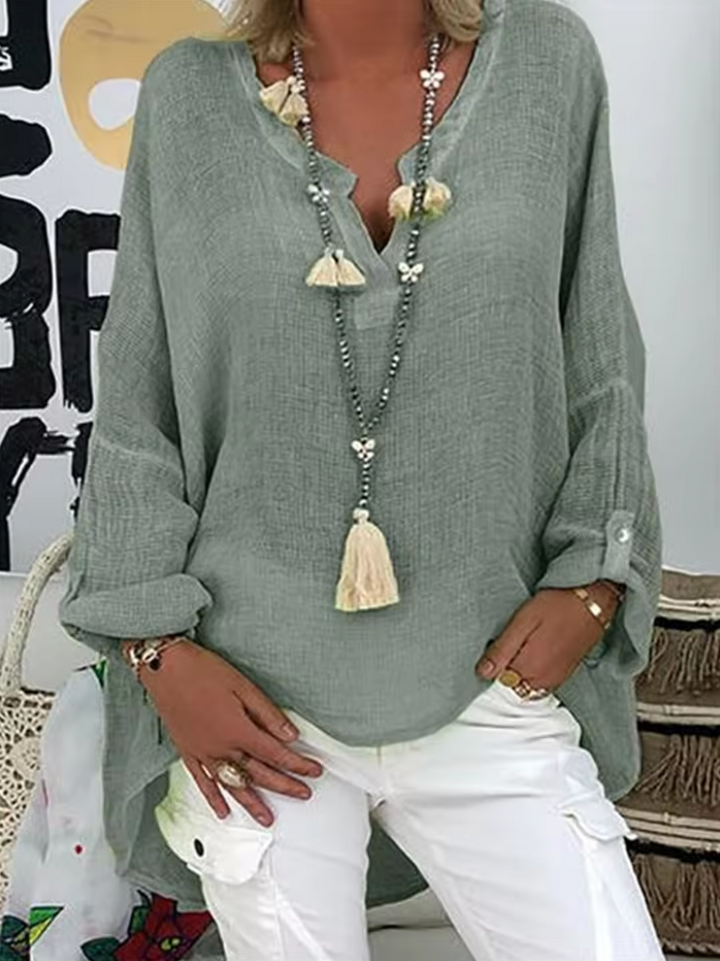 Modern women's chic oversized blouse for versatile summer fashion & relaxed elegant comfort.