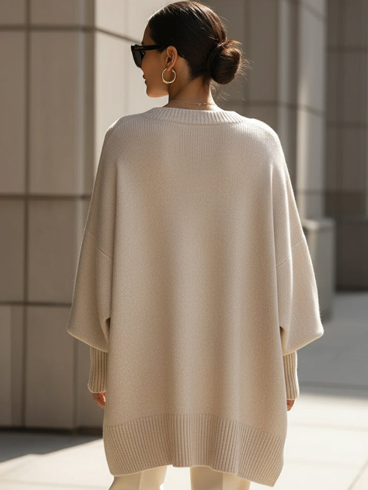 Comfortable women's oversized sweater. Stylish knit top for everyday elegance & relaxed wear.